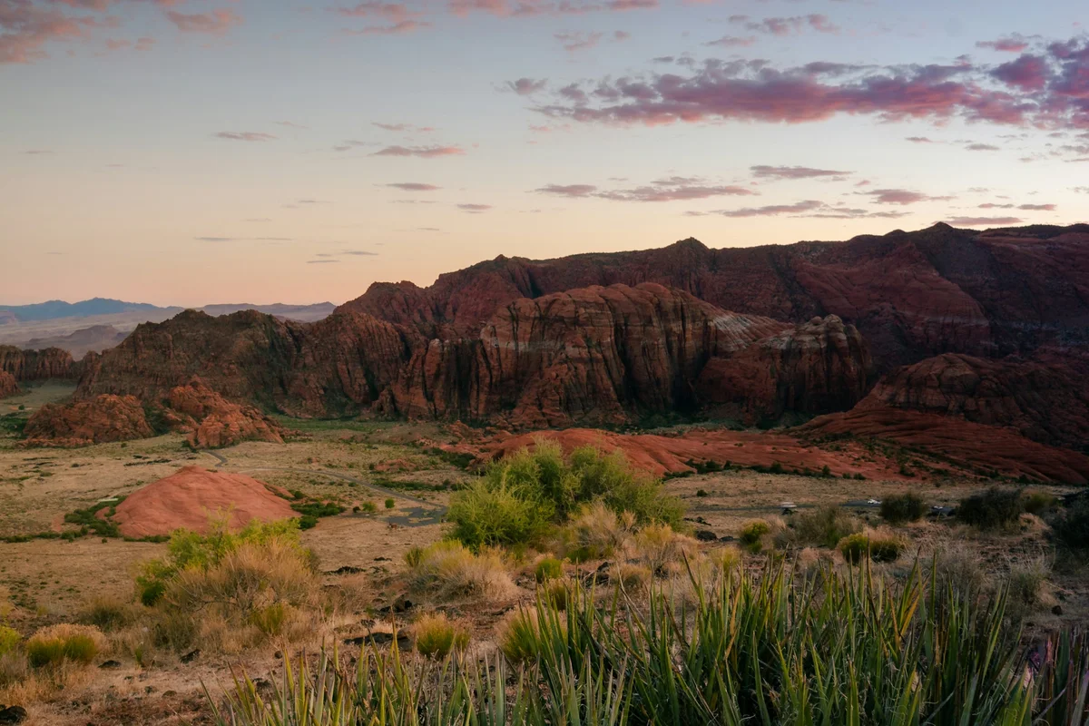 Sunset over the red sandstone cliffs and desert landscape of Snow Canyon near St. George, Utah