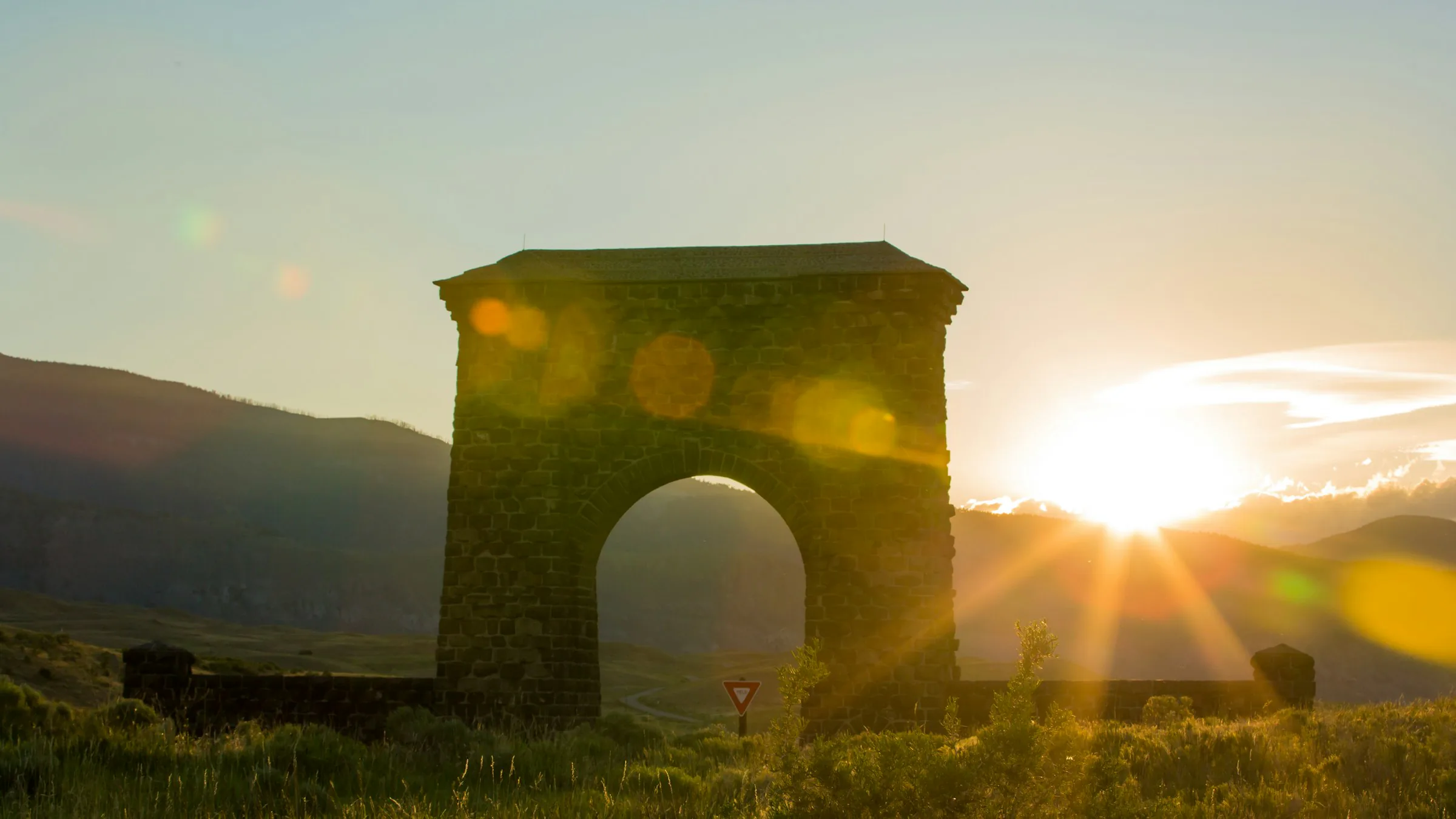 The Roosevelt Arch at the north entrance of Yellowstone at sunset