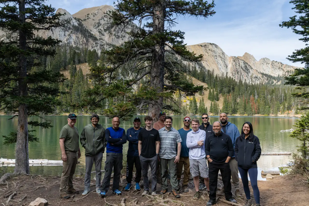 CIO Ascent's inaugural retreat participants together beside a Montana mountain lake