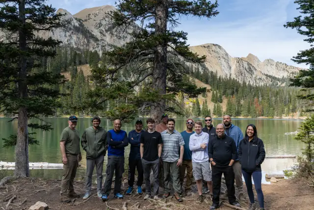 CIO Ascent retreat group at an alpine lake in the mountains near Bozeman